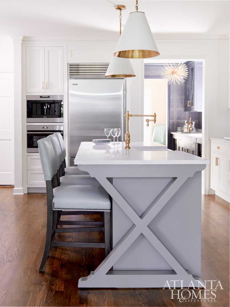 Transitional Kitchen with modern accents and stunning island www.pattersondecoratinggroup.com/blog