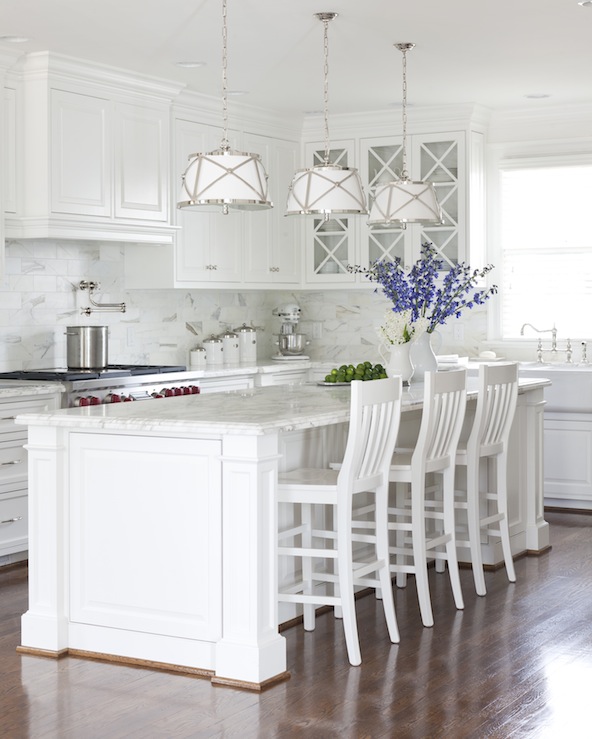 Here is a kitchen with cabinets painted with BM White Dove, which is a soft warm white with a touch of gray www.pattersondecoratinggroup.com/blog