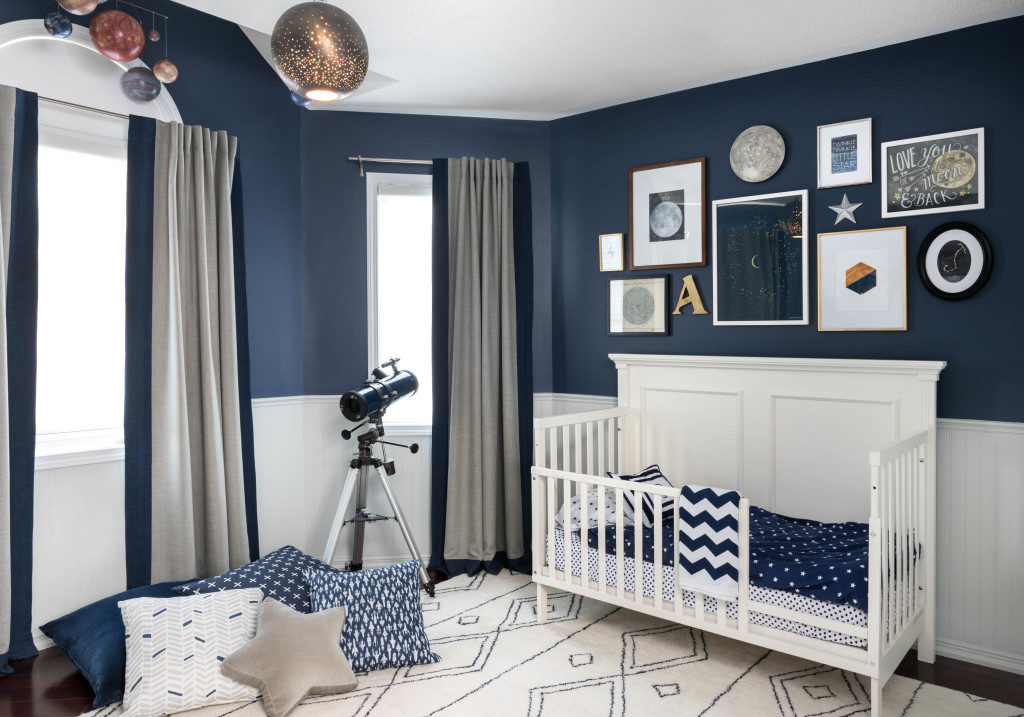 Baby Boy's bedroom with navy walls and white wainscott www.PattersonDecoratingGroup.com/blog 
