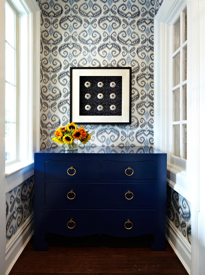 Blue Rooms hallway with a bold Ikat wallpaper www.PattersonDecoratingGroup.com/blog