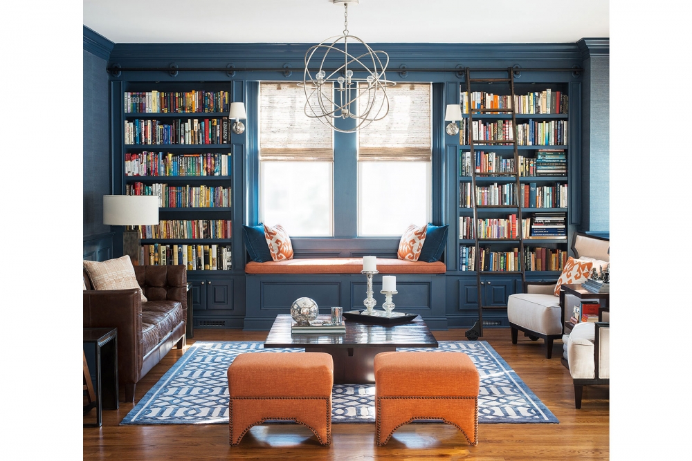 Blue Rooms with Blue Built-ins and coral ottomans www.pattersondecoratinggroup.com/blog