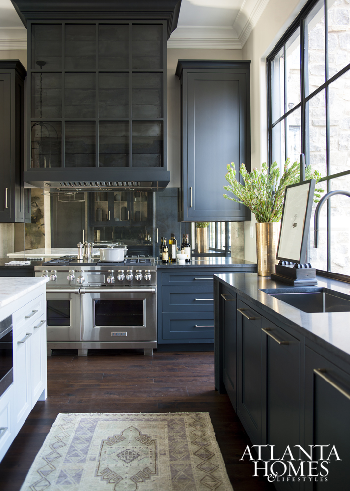 Sophisticated Navy Kitchen with layered hood and antique mirrored backsplash Blue Rooms www.PattersonDecoratingGroup.com/blog