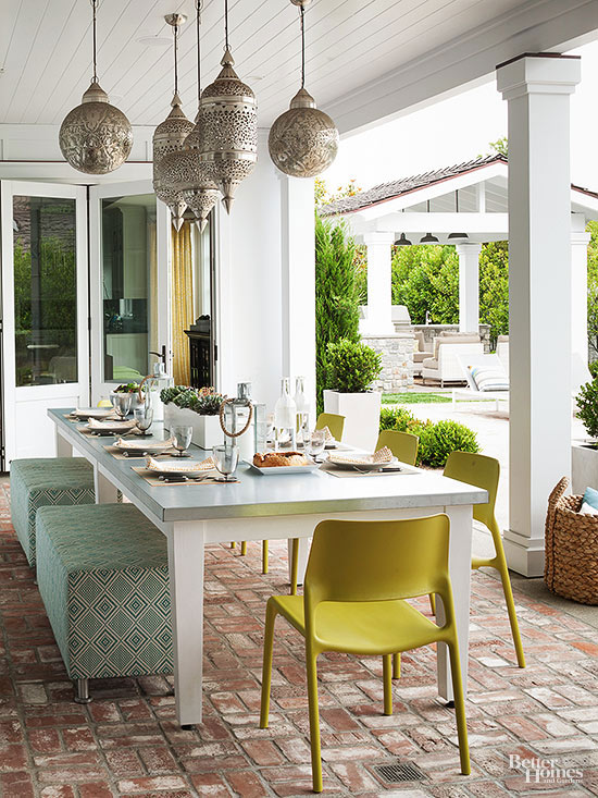 Outdoor Dining area with unique silver sconces in different shapes provide a fun focal point www.PattersonDecoratingGroup.com/blog