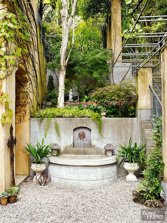Outdoor space with a fountain with for relaxing with the sound of moving water www.PattersonDecoratingGroup.com/blog