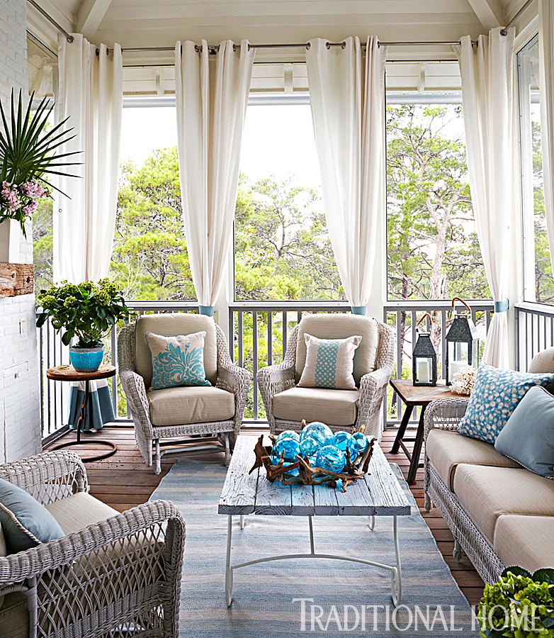 Porch with curtains and rug create the feeling of a true outdoor room www.PattersonDecoratingGroup.com/blog