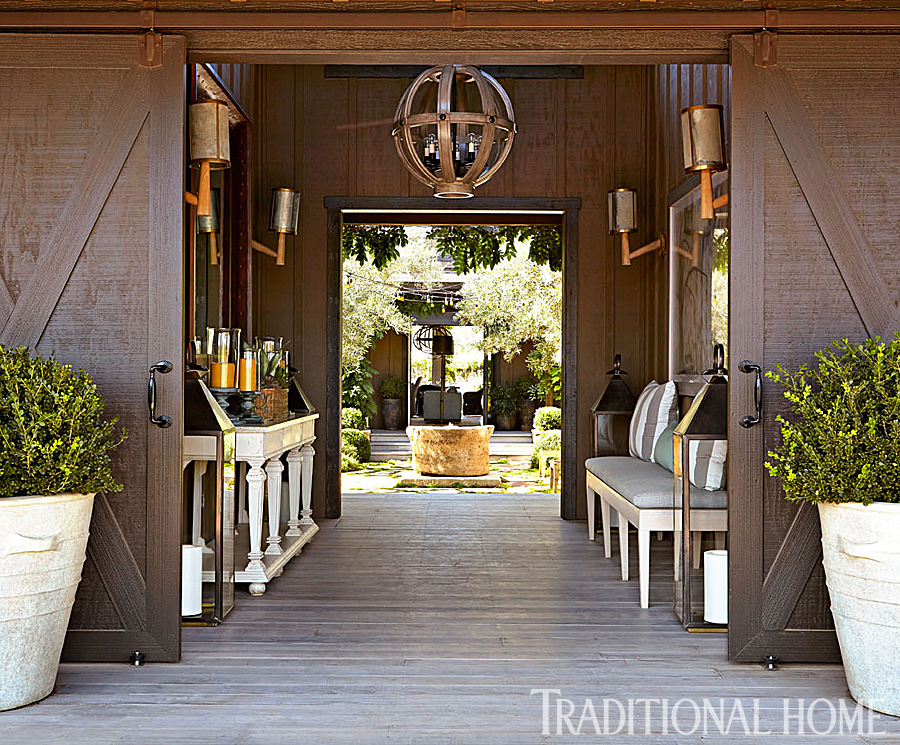 Breezeway entry with custom doors and over sized lighting www.PattersonDecoratingGroup.com/blog