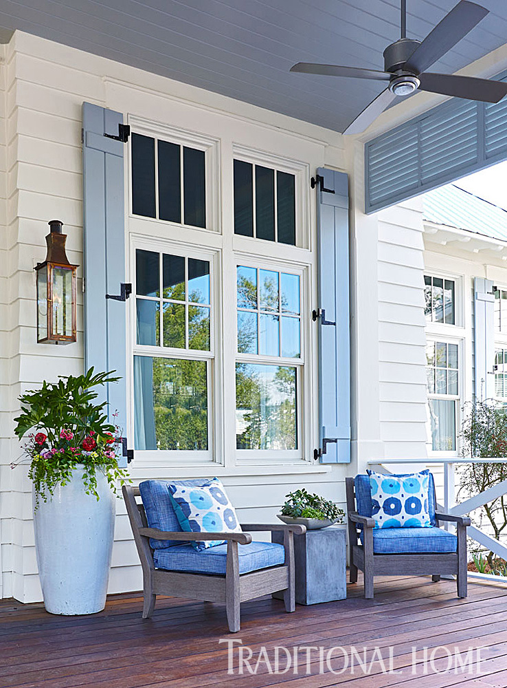 Deep porch with a ceiling fan allows friends and family to enjoy the outside www.PattersonDecoratingGroup.com/blog