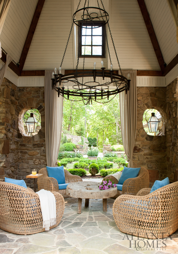 Outdoor living space set among lush gardens and grounds www.PattersonDecoratingGroup.com/blog