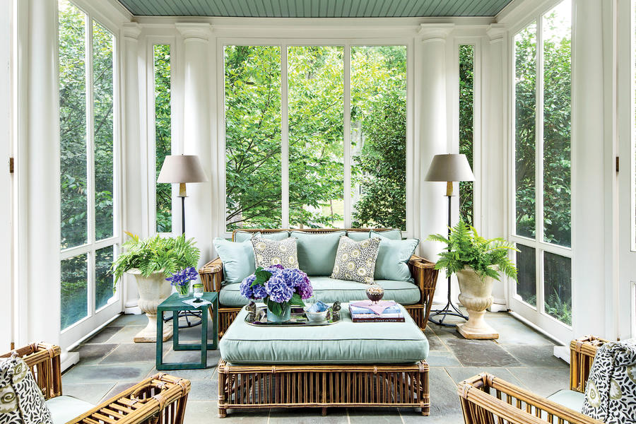 Porch with a natural palette and bluestone floor and cool-toned ocean blue ceiling, upholstery and accents www.PattersonDecoratingGroup.com/blog