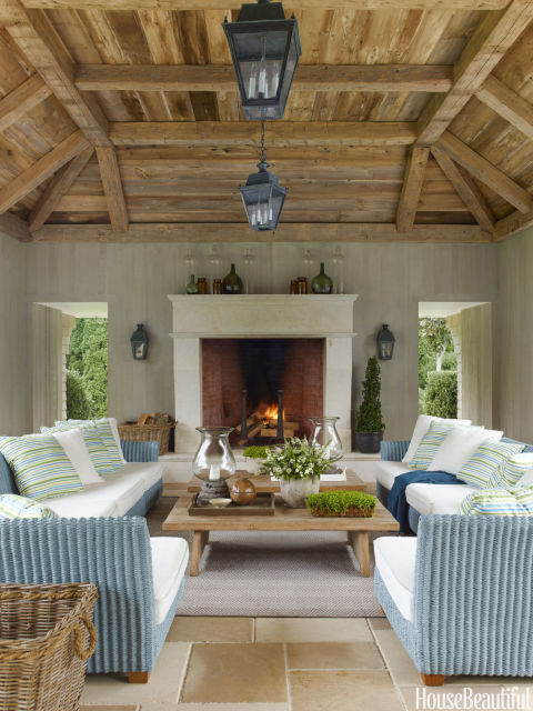 Outdoor Hampton house loggia with massive fireplace www.PattersonDecoratingGroup.com/blog
