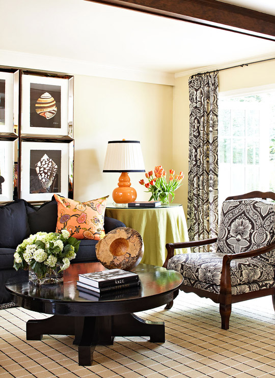 Black-and-white family room by super talented Designer Tobi Fairley gets drama from orange and lime-green accessories ww.PattersonDecoratingGroup.com/blog