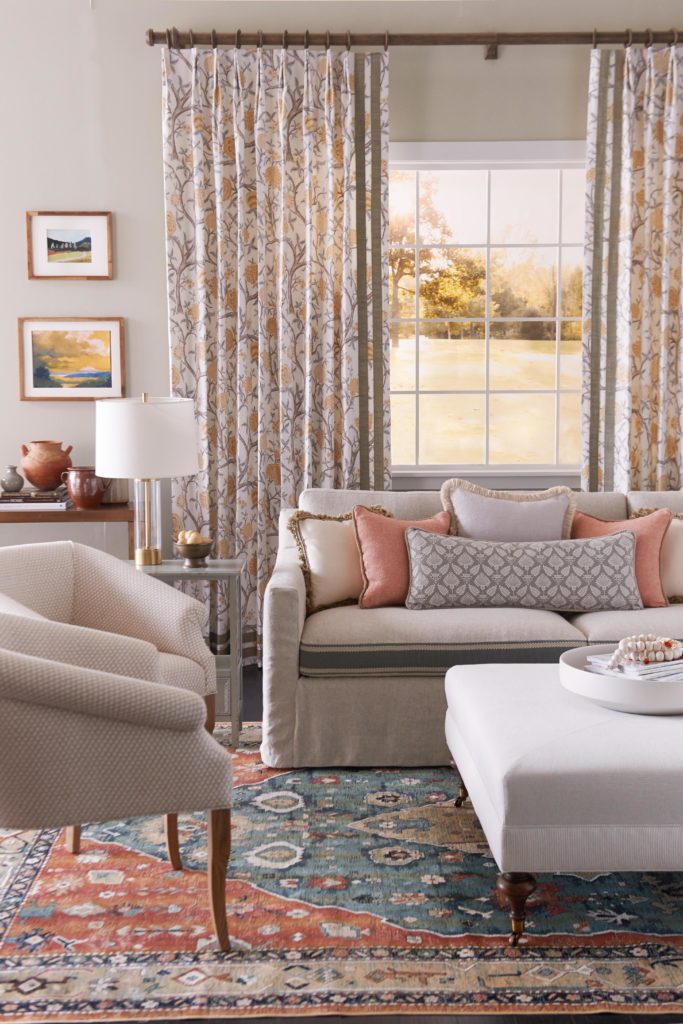 Pleated floral drapes with banded trim from Fabricut www.PattersonDecoratingGroup.com/blog