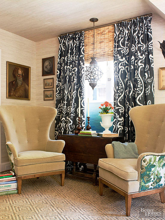 Patterned drapes call attention to the windows and create architectural interest in a boxy space www.PattersonDecoratingGroup.com/blog