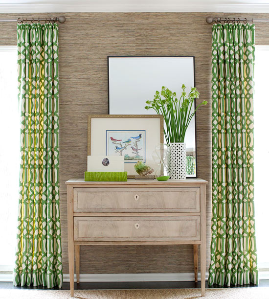 Boldly patterned geometric drapes balances the neutral color scheme www.PattersonDecoratingGroup.com/blog