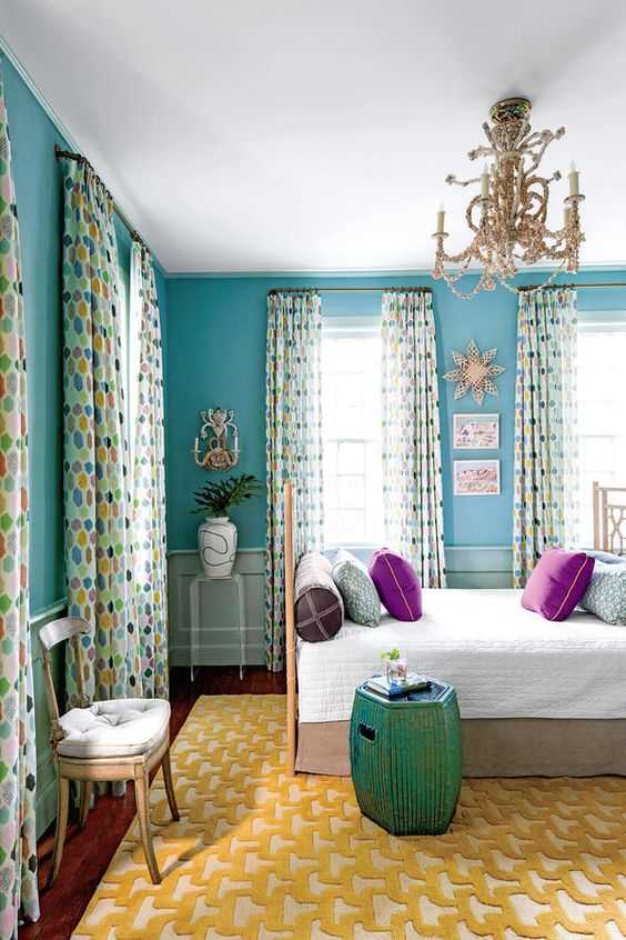 Small turquoise space with a daybed for increased flexibility and functionality www.PattersonDecoratingGroup.com/blog