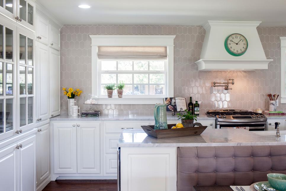 Perfect family kitchen with patterned back-splash and white cabinetry www.PattersonDecoratingGroup.com/blog