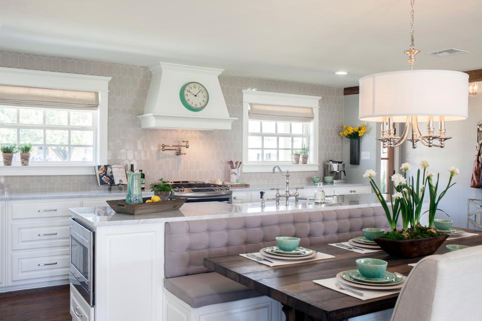 Kitchen with creative floor plan that incorporates bench seating with the island www.PattersonDecoratingGroup.com/blog