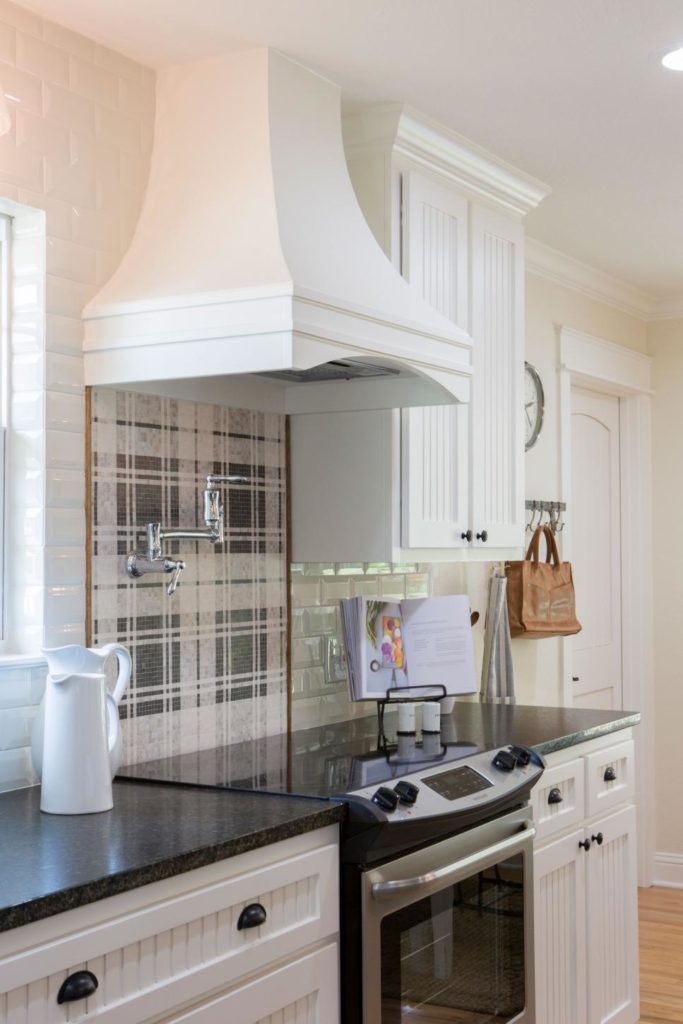Fixer Upper Graham House Kitchen with new wood vent hood and new appliances www.PattersonDecoratingGroup.com/blog